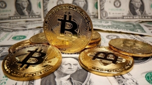 What are the implications of the adoption of Bitcoin as legal tender and its relationship with taxes?
